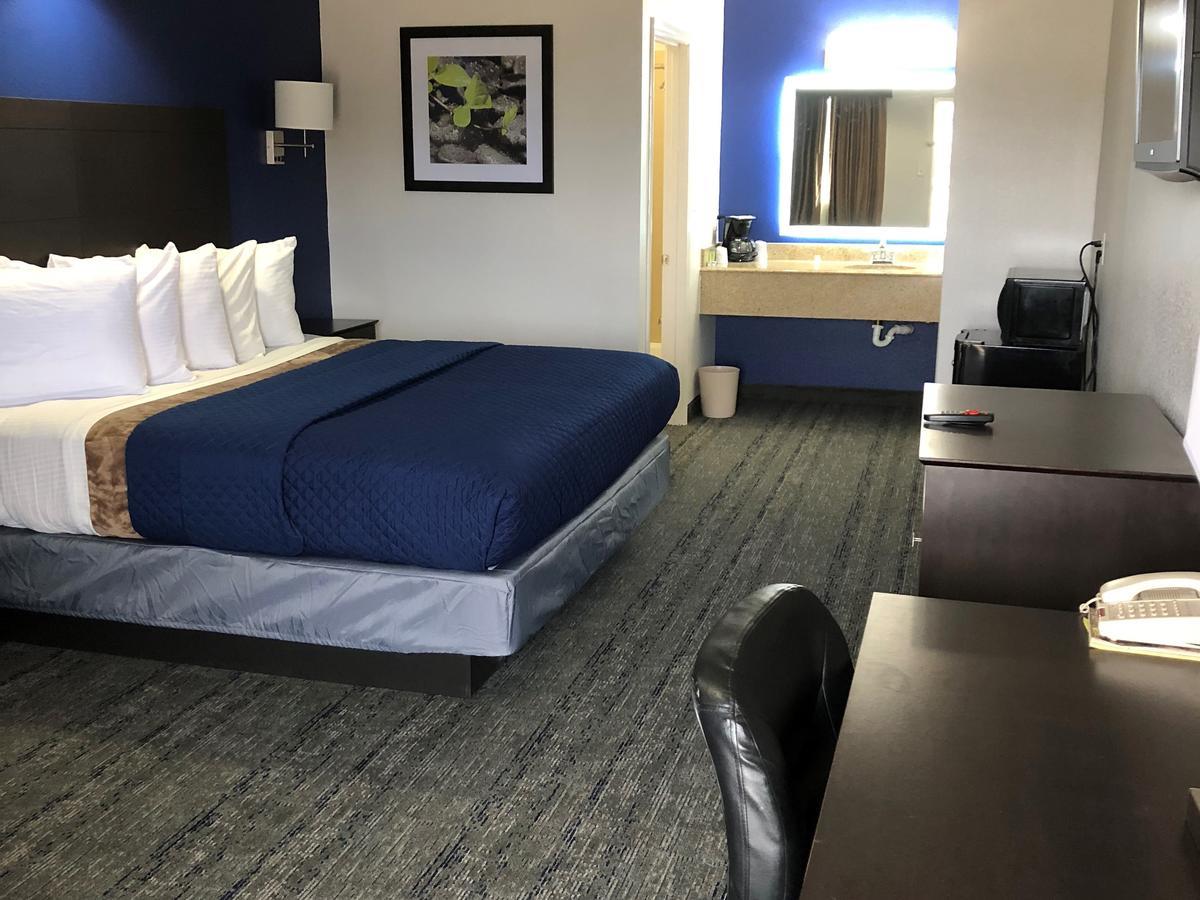Executive Inn And Suites Joaquin Buitenkant foto